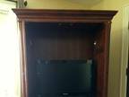 solid wood entertainment center/armoire
