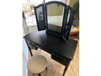 Black vanity with mirror and stool