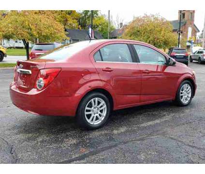 2012 Chevrolet Sonic LT is a Red 2012 Chevrolet Sonic LT Car for Sale in Paw Paw MI