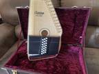 Beautiful Oscar Schmidt autoharp plus tuner, books and after-market carrying