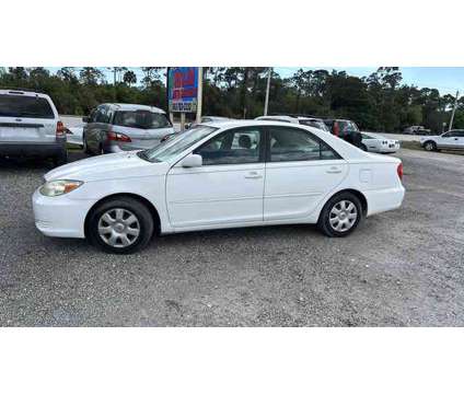 2002 Toyota Camry for sale is a White 2002 Toyota Camry Car for Sale in Okeechobee FL