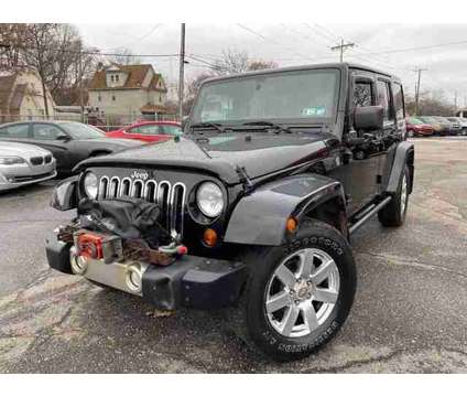2012 Jeep Wrangler for sale is a Black 2012 Jeep Wrangler Car for Sale in Akron OH