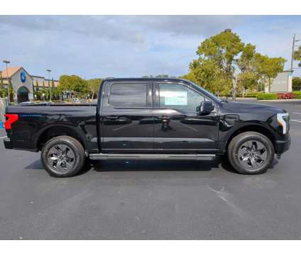 2023 Ford F-150 Lightning XLT is a Black 2023 Ford F-150 Car for Sale in Estero FL