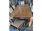 Oak dining table with six chairs. expandable to seat 8