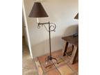Metal floor lamp with copper overtones. Shade is leather looking with leather