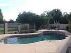 House with spacious yard, Pool, theatre, 3 car garage and bar!