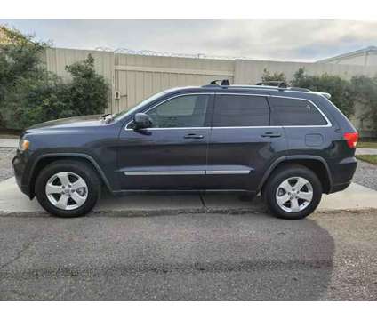 2013 Jeep Grand Cherokee for sale is a Blue 2013 Jeep grand cherokee Car for Sale in Kenner LA