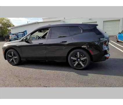 2024 BMW iX xDrive50 is a Grey 2024 BMW 325 Model iX SUV in Jacksonville FL