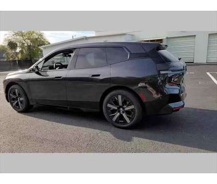 2024 BMW iX xDrive50 is a Grey 2024 BMW 325 Model iX SUV in Jacksonville FL