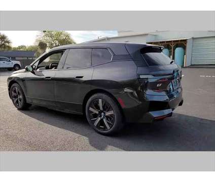 2024 BMW iX xDrive50 is a Grey 2024 BMW 325 Model iX SUV in Jacksonville FL