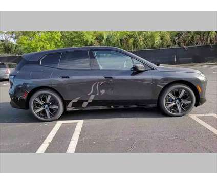 2024 BMW iX xDrive50 is a Grey 2024 BMW 325 Model iX SUV in Jacksonville FL