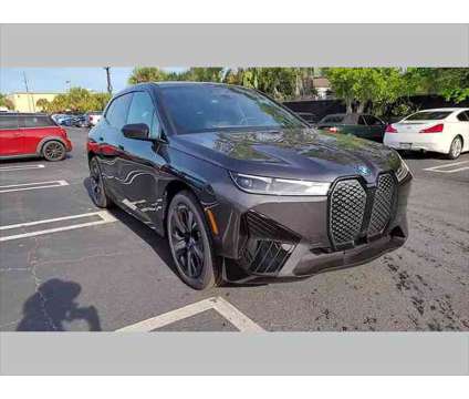 2024 BMW iX xDrive50 is a Grey 2024 BMW 325 Model iX SUV in Jacksonville FL