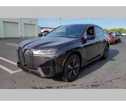 2024 BMW iX xDrive50 is a Grey 2024 BMW 325 Model iX SUV in Jacksonville FL