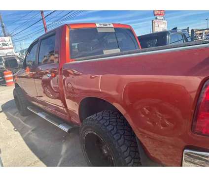 2009 Dodge Ram 1500 Crew Cab for sale is a Orange 2009 Dodge Ram 1500 Car for Sale in Houston TX