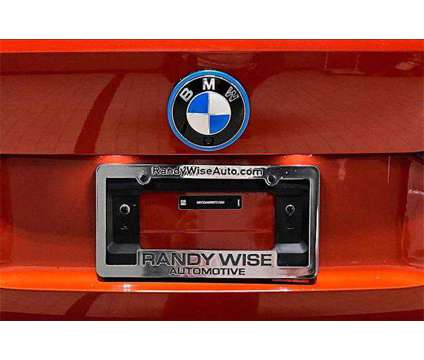 2024 BMW i4 M50 is a Orange 2024 Sedan in Grand Blanc MI