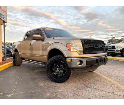 2013 Ford F150 SuperCrew Cab for sale is a Tan 2013 Ford F-150 SuperCrew Car for Sale in Orlando FL