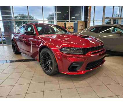 2023NewDodgeNewChargerNewRWD is a Red 2023 Dodge Charger R/T Scat Pack Sedan in Lewisville TX