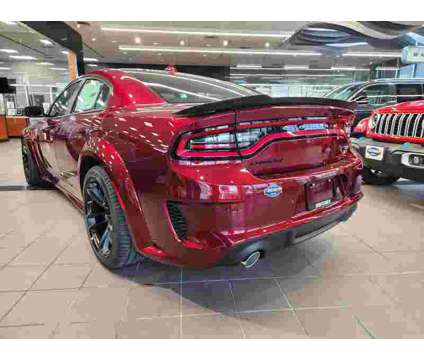 2023NewDodgeNewChargerNewRWD is a Red 2023 Dodge Charger R/T Scat Pack Sedan in Lewisville TX