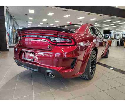 2023NewDodgeNewChargerNewRWD is a Red 2023 Dodge Charger R/T Scat Pack Sedan in Lewisville TX
