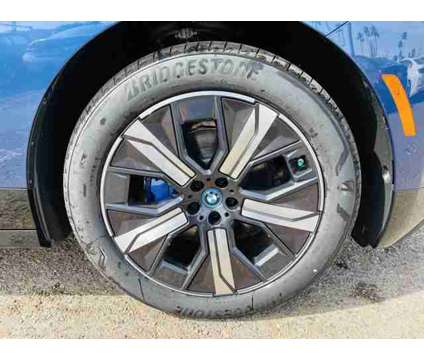 2024 BMW iX xDrive50 is a Blue 2024 BMW 325 Model iX SUV in Mcallen TX