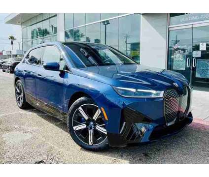 2024 BMW iX xDrive50 is a Blue 2024 BMW 325 Model iX SUV in Mcallen TX