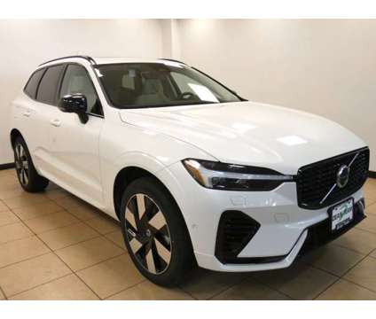 2024 Volvo XC60 Recharge Plug-In Hybrid Plus Dark Theme is a White 2024 Volvo XC60 3.2 Trim Hybrid in Saint Louis MO