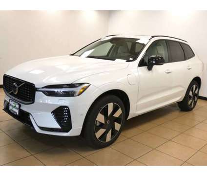 2024 Volvo XC60 Recharge Plug-In Hybrid Plus Dark Theme is a White 2024 Volvo XC60 3.2 Trim Hybrid in Saint Louis MO