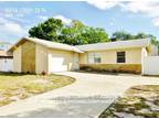 Intimate 4BR/2BA located in the beautiful Boca Ciega Ridge 8213 129th St N