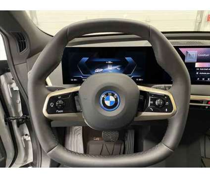 2024 BMW iX xDrive50 is a White 2024 BMW 325 Model iX SUV in Erie PA