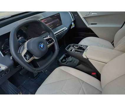 2024 BMW iX xDrive50 is a Red 2024 BMW 325 Model iX SUV in Seaside CA
