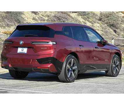 2024 BMW iX xDrive50 is a Red 2024 BMW 325 Model iX SUV in Seaside CA