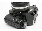 Nikon EM 35mm SLR w/Nikon Nikkor 50mm f1.8 lens, strap, new seals, very clean!