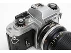 Nikon FG 35mm SLR w/Nikon 35-105mm f3.5-4.5 Macro zoom lens, new seals, manual