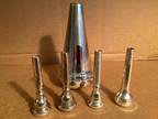 Lot Of 4 Trumpet Mouthpieces And 1 Harmon Mute.