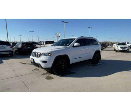 2021 Jeep Grand Cherokee Laredo E 4x4 is a White 2021 Jeep grand cherokee Laredo SUV in Grand Island NE