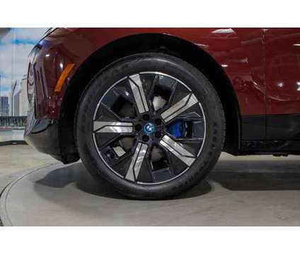 2024 BMW iX xDrive50 is a Red 2024 BMW 325 Model iX SUV in Lake Bluff IL