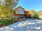 Magnificent 3 Level Log Home