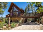 Elegant mountain chalet situated on a mostly level .24 acre lot