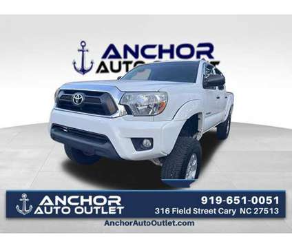2015 Toyota Tacoma PreRunner V6 is a White 2015 Toyota Tacoma PreRunner Truck in Cary NC