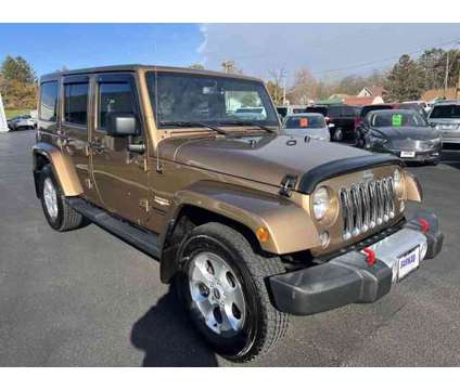 2015 Jeep Wrangler Unlimited Sahara is a Brown 2015 Jeep Wrangler Unlimited Sahara SUV in Freeport IL