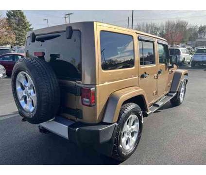 2015 Jeep Wrangler Unlimited Sahara is a Brown 2015 Jeep Wrangler Unlimited Sahara SUV in Freeport IL