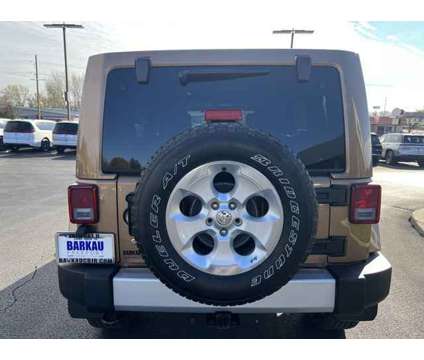 2015 Jeep Wrangler Unlimited Sahara is a Brown 2015 Jeep Wrangler Unlimited Sahara SUV in Freeport IL