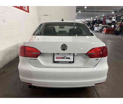 2014 Volkswagen Jetta 1.8T SE is a White 2014 Volkswagen Jetta 1.8T SE Sedan in Chandler AZ