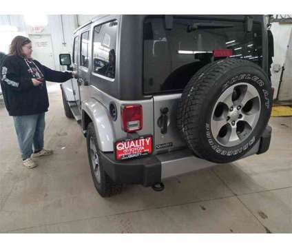 2018 Jeep Wrangler JK Unlimited Sahara is a Silver 2018 Jeep Wrangler Unlimited Sahara SUV in Fergus Falls MN