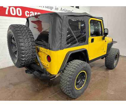 2004 Jeep Wrangler Rubicon is a Yellow 2004 Jeep Wrangler Rubicon SUV in Chandler AZ