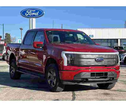 2023 Ford F-150 Lightning Lariat AWD is a Red 2023 Ford F-150 Lariat Truck in Manteno IL