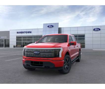 2023NewFordNewF-150 LightningNew4WD SuperCrew 5.5 Box is a Red 2023 Ford F-150 Lariat Car for Sale in Columbus GA