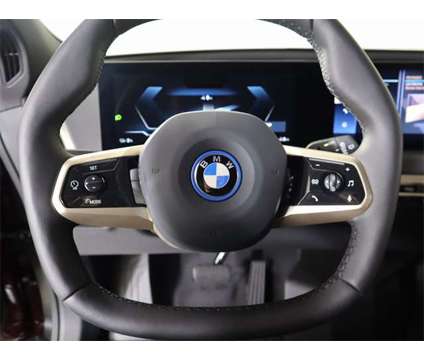2024 BMW iX xDrive50 Sales Demo is a Red 2024 BMW 325 Model iX SUV in Edmond OK