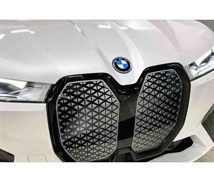 2024 BMW iX xDrive50 is a White 2024 BMW 325 Model iX SUV in Grand Blanc MI