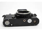 Nikon FE SLR film camera (1981) with Nikkor-H Auto 50mm F2 lens and PK-3 X-tube